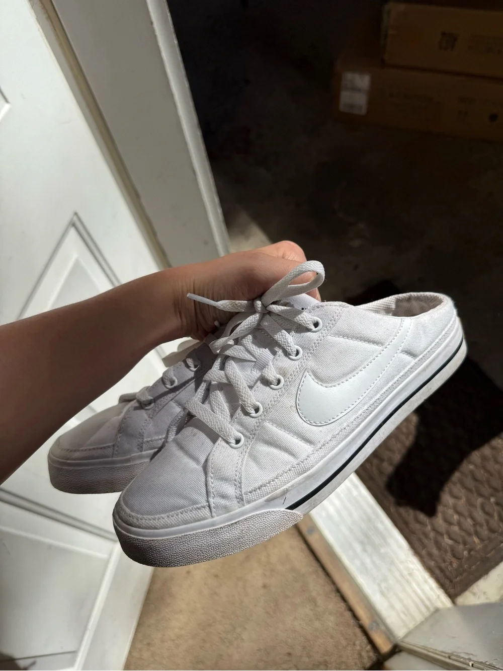 Nike Women’s White Canvas slip-on Sneakers